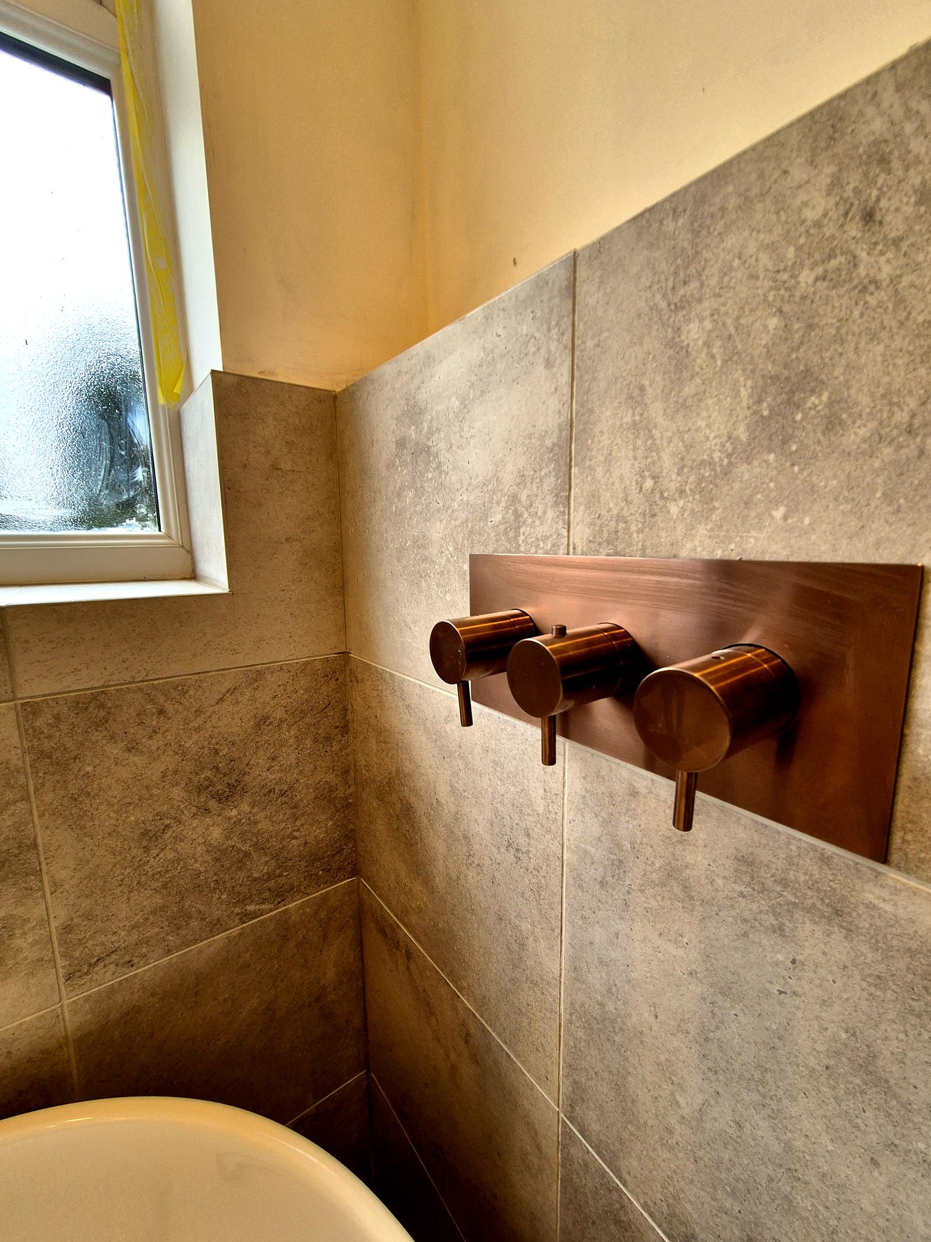 Brushed copper wall-mounted shower valves